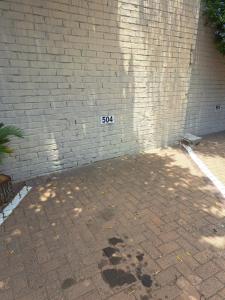 a brick wall with the number on it at The Stetson in Paarl