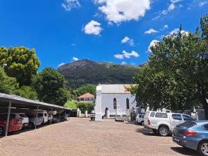 a parking lot with a mountain in the background at Kaneel Suiker in Paarl