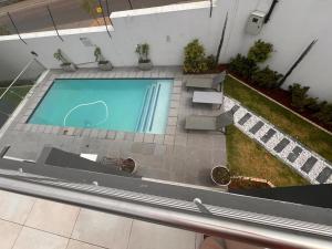 an overhead view of a swimming pool in a building at Sublime - By LaSerene - Carlswald in Midrand