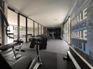 a gym with several treadmills and machines in it at Sublime - By LaSerene - Carlswald in Midrand