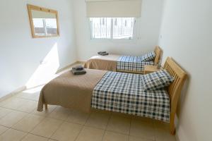 a bedroom with two beds and a window at 2 bed, Kapparis, Varvara - 2A in Paralimni +9 photos