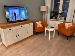 TV a/nebo společenská místnost v ubytování Hansestübchen