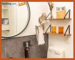 a bathroom with a mirror and a sink at T2 Relax & Cosy en Toscane occitane-Gaillac hypercentre in Gaillac