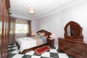 מיטה או מיטות בחדר ב-Appartement Tetouan Saniat Ramel Airport Plage Martil WIFI