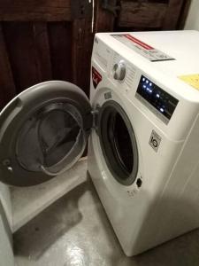 a white washing machine sitting next to a washer at Tizapán 2 Beautiful apartment with patio 1BE/1BA in Mexico City
