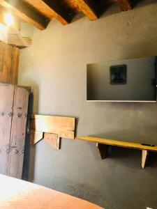 a shelf on a wall with a television on it at Tizapán 2 Beautiful apartment with patio 1BE/1BA in Mexico City