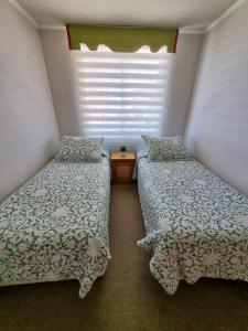 A bed or beds in a room at Departamento Frente Playa las Torpederas