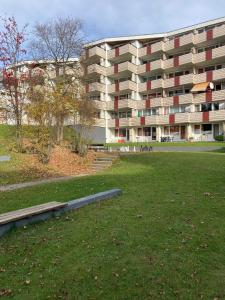 a large apartment building with a park in front of it at Wildwood Lodge Ferienwohnung mit Wellness in Sankt Englmar