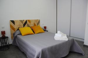 Postel nebo postele na pokoji v ubytování PASSAR P'LAS BRASAS