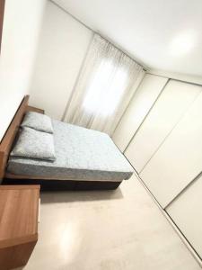 Llit o llits en una habitació de Apartamento Valencia capital 6