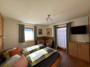 Postel nebo postele na pokoji v ubytování Ferienwohnungen Unterfeld + 54 fotografií