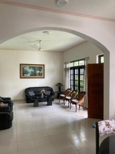 a living room with a couch and a table at Mirihana Residence in Nugegoda
