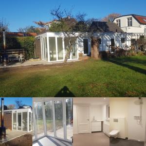 una casa reformada con un salón acristalado y una casa en Zelfstandig gastenverblijf in het groene Haren nabij Groningen, en Haren