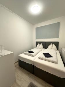 Postel nebo postele na pokoji v ubytování Berzsenyi Apartmanház