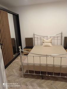 a bedroom with a bed in a room at Apartament u Danuty in Białystok