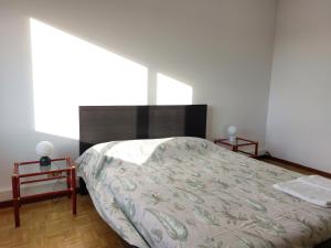 Ένα ή περισσότερα κρεβάτια σε δωμάτιο στο Appartamento Codroipo Centrale