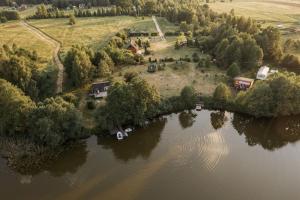 an aerial view of an island in the middle of a lake at Sodyba Gaižėnai in Vinkšnupiai