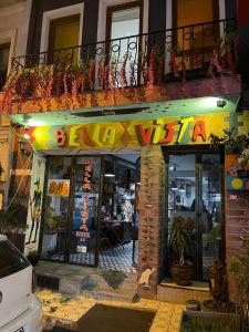 a restaurant with a sign on the front of a building at GRAND BELLA VİSTA Hostel in Istanbul