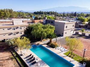 an overhead view of a swimming pool in front of a building at Hotel Cuesta de Miranda in Villa Unión