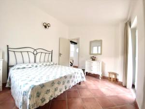 a bedroom with a bed and a dresser in it at Villa Gisella in San Marco dʼAlunzio +35 photos