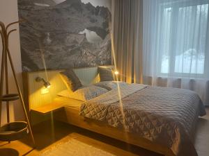 Posteľ alebo postele v izbe v ubytovaní Apartmán Sirius