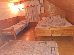 Postel nebo postele na pokoji v ubytování Vikendica Savic TKM