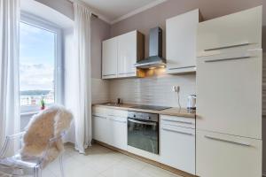 Kuchyň nebo kuchyňský kout v ubytování Captain Emo City Apartments