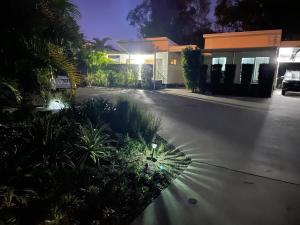a driveway of a house at night at 545 Esplanade in Hervey Bay