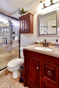 a bathroom with a toilet and a sink and a shower at Wine Country Retreat in Paso Robles