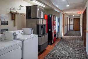 a room with a kitchen with aasteryasteryasteryasteryasteryasteryasteryasteryastery at Super 8 by Wyndham Livingston in Livingston