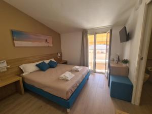 Postel nebo postele na pokoji v ubytování B&B Al Quadrato