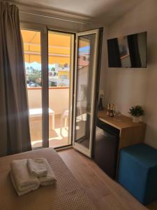 Postel nebo postele na pokoji v ubytování B&B Al Quadrato