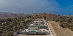 an aerial view of a house on a hill at Niki Cretan Villas in Sívas