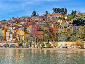 a view of a city from the water at Prato Home - apartment near the beach in Menton in Menton
