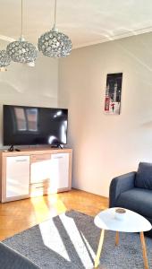 TV a/nebo společenská místnost v ubytování Léna's apartman