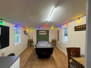 a billiard room with a pool table in it at The Cow Shed in Narberth