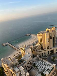 an aerial view of a resort and the beach at Ft 30f R2 SeaView Room at Beach with separate bath in Ajman 