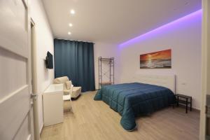 Ένα ή περισσότερα κρεβάτια σε δωμάτιο στο B&B Nonna Maria