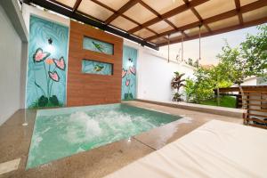 a swimming pool in the middle of a house at Markinkia - Estancia Amazónica in Macas