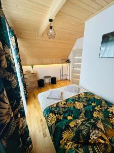 a bedroom with a bed in a room at FAMILY HAUSE in Witów