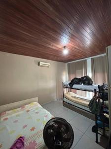 Łóżko lub łóżka w pokoju w obiekcie Rancho condomínio Terras d barra