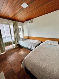 מיטה או מיטות בחדר ב-Flat 707 Villa Hípica Gravatá PE