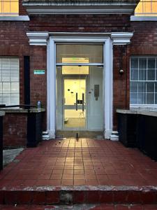 an entrance to a building with a glass door at Leicester Studio at City Centre with free parking in Leicester