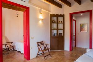 Ένα ή περισσότερα κρεβάτια σε δωμάτιο στο Ca la Roseta