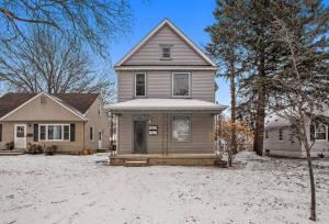 a house in the snow in front at 2 Bedroom/1 bath Upper Duplex in Hopkins