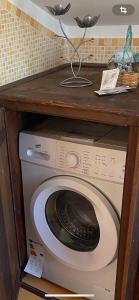 a washer and dryer under a counter in a kitchen at MARE AZZURRO in Campofelice di Roccella