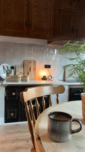 a kitchen with a table with a pot on a table at Mountain View Apartment in Mieres