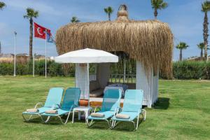 a group of chairs and a gazebo at Wyndham Garden Lara in Lara