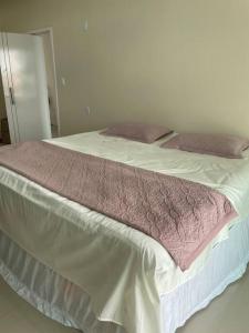Ένα ή περισσότερα κρεβάτια σε δωμάτιο στο Casa Festival de Parintins 2024