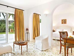 A seating area at Caramel, A Grecotel Resort to Live